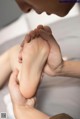 A woman getting a foot massage at a spa.