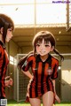 A couple of girls standing next to each other on a soccer field.