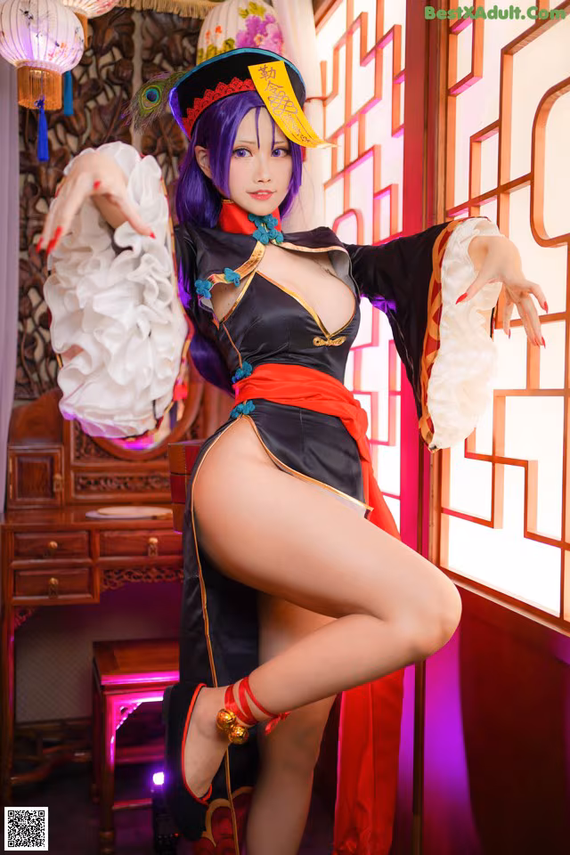 A woman in a black and red outfit posing for a picture.