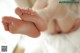 A close up of a baby's feet on a bed.